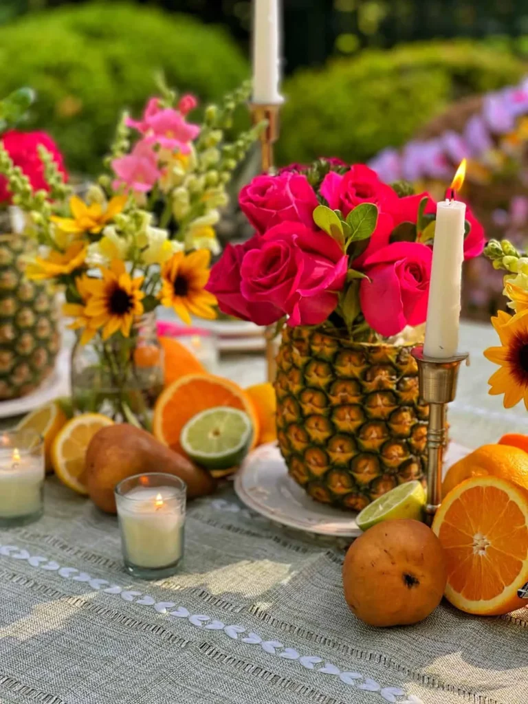 How to incorporate fresh flowers and fruits into a party theme?