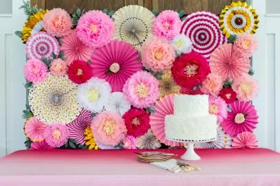 What are some tips for decorating a flower backdrop for an event?