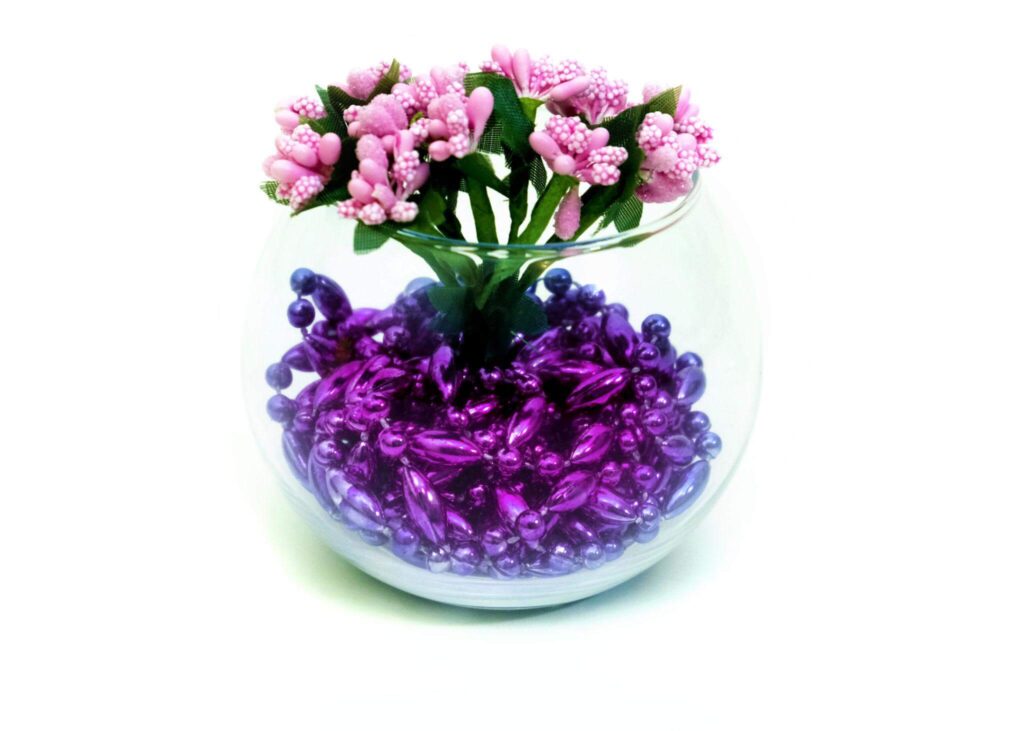 Artificial flower arranging for beginners in decorative glass bowl
