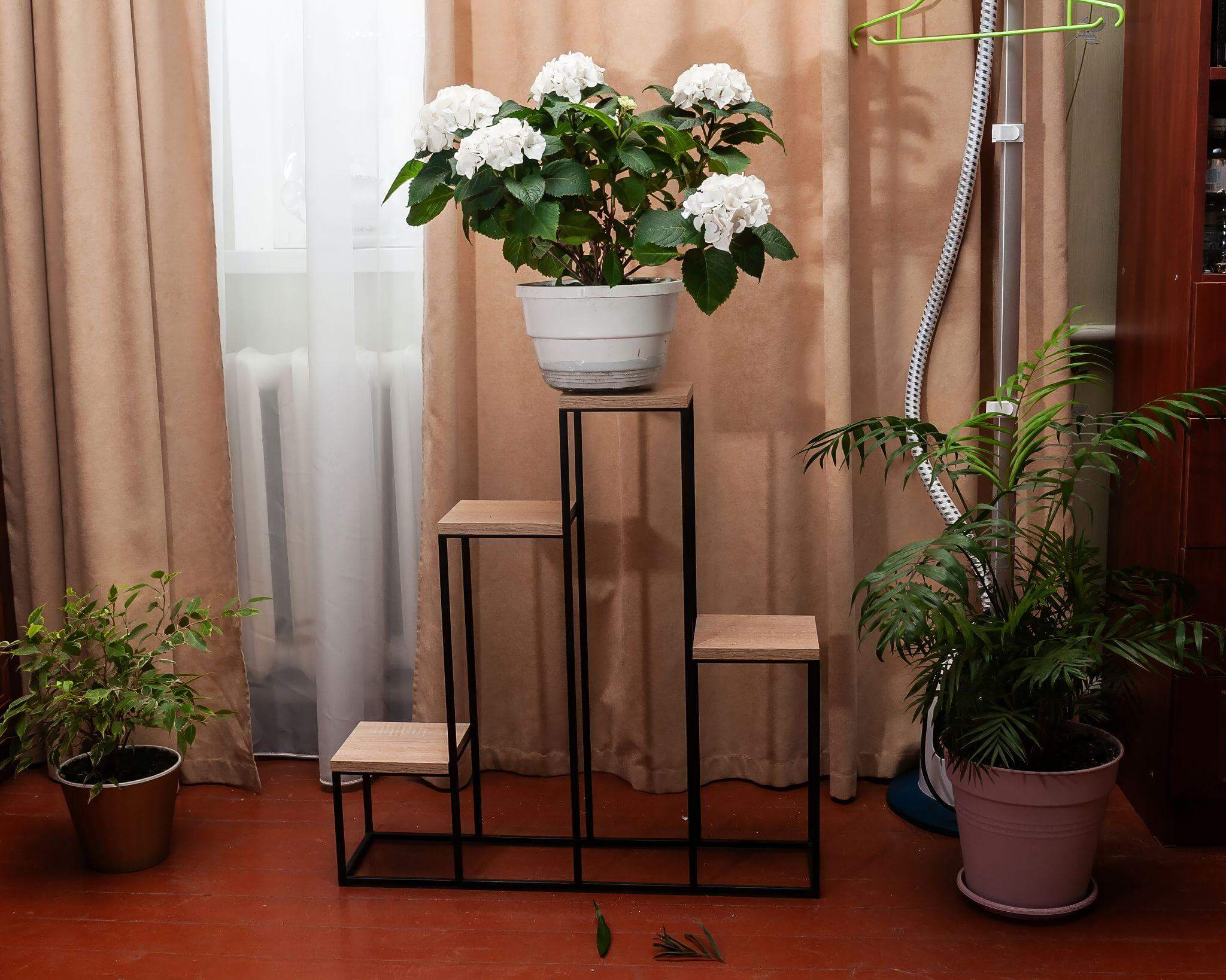 Artificial flower storage ideas using clear containers and tiered display shelves